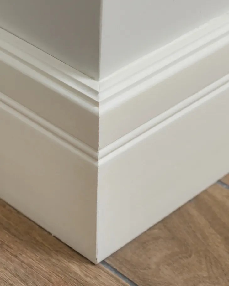 Close-up of a clean floor corner near a baseboard